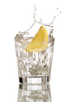 lemon splashing in cocktail isolated on white stock photo