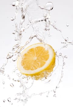 splash of water on lemon close up shoot