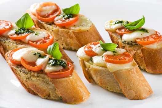 Tomato, mozzarella and basil sandwich close up