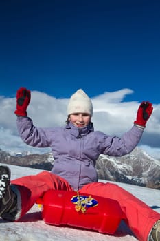 A girl sliding in the snow
