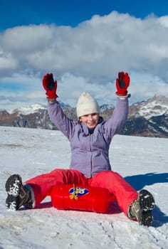 A girl sliding in the snow