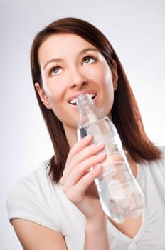 young beautiful brunette woman drinking water close up