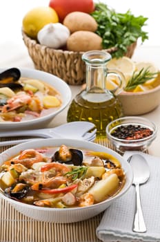 Fresh seafood soup with vegetables close up shoot