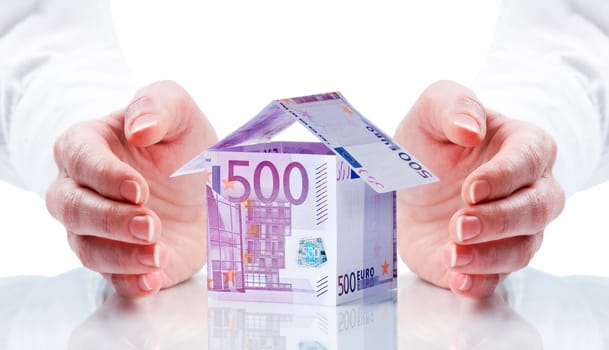 House made of money isolated on white background