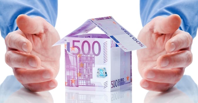 House made of money isolated on white background