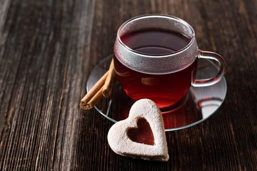 Red hot tea with cookie close up shoot