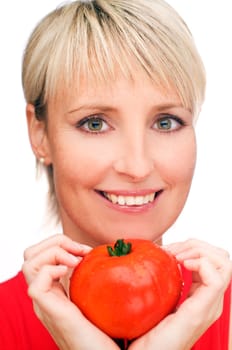 blond girl with a ripe red tomato