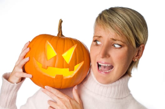 close up of a woman holding halloween pumpkin