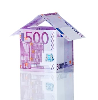 House made of money isolated on white background