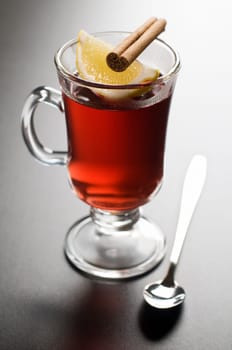 Cup of tea with lemon and cinnamon close up