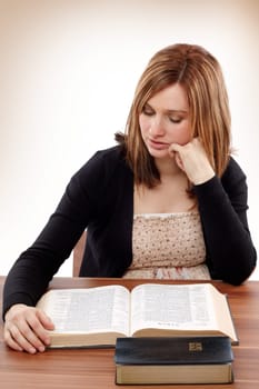 Young christian woman reading for Bible study