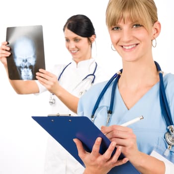Medical team doctor young nurse female smiling look head x-ray