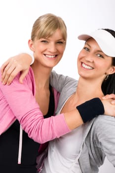 Two women friends sport outfit hugging smiling isolated portrait