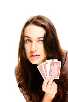 Young woman playing poker on white background