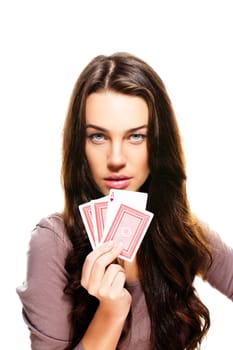 Young beautiful woman holding poker cards on white background