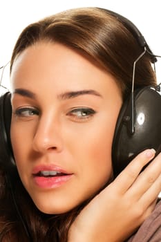 Close-up of a young woman listening to music