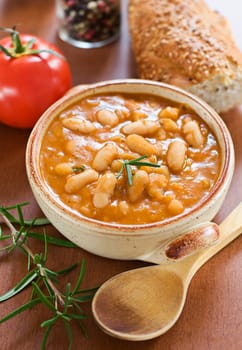 White bean stew with bread close up
