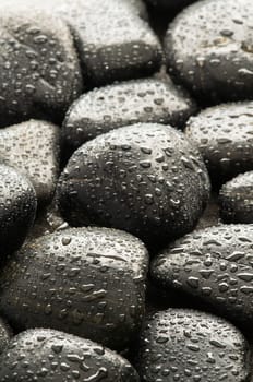 Wet spa stones close up background shoot