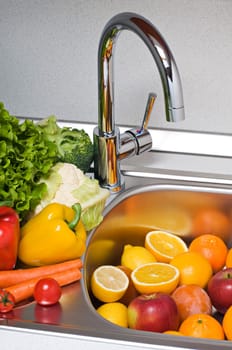 Fruits and vegetables prepared for washing close up shoot