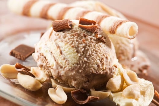 Chocolate ice cream with nuts close up