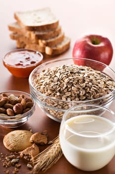Muesli with apple, jam, milk and nuts - healthy breakfast