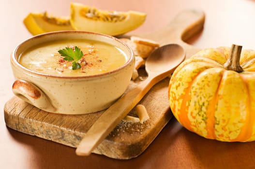 Fresh orange pumpkin soup close up shoot