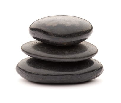 Black spa stones isolated on white close up