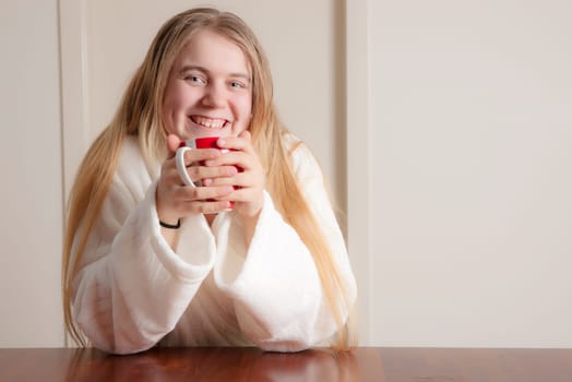 young woman having coffee in the morning