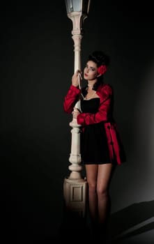 beautiful young glamorous woman  with lightpole
