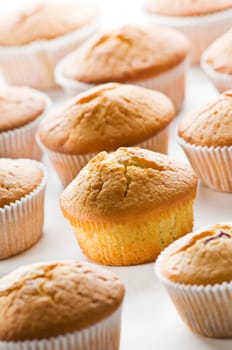 Freshly baked yellow muffins close up shoot