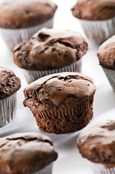 Freshly baked chocolate muffins close up shoot