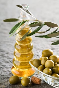 extra virgin olive oil with branch close up