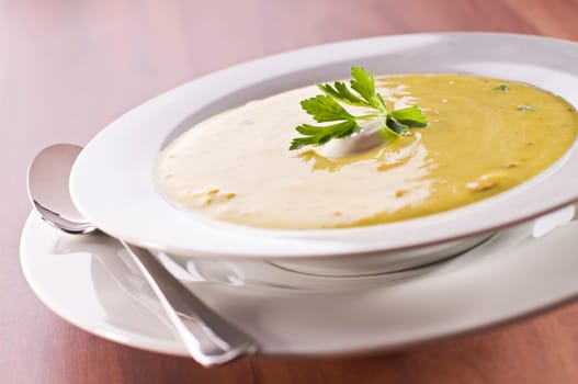 Fresh hot orange pumpkin soup close up