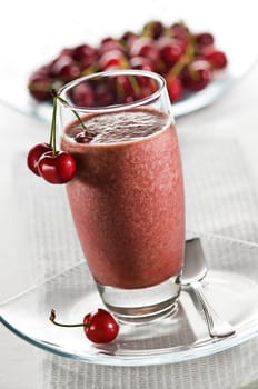 Cold cherry smoothie in glass close up