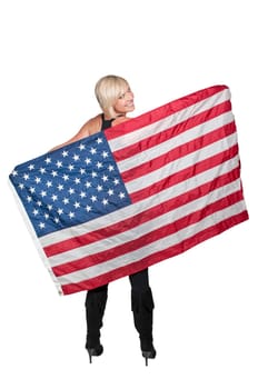 A beautiful young woman holding an American flag