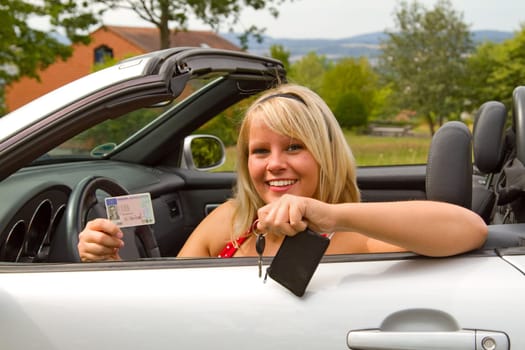 Young woman with car key