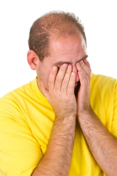 Young man covering his eyes - isolated on white background