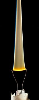 An electical element in a light bulb igniting and burning out