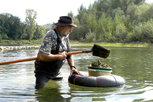prospector panning for gold in rivers in France in the Gard region