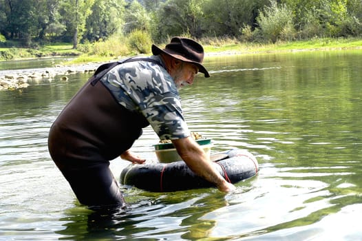 prospector panning for gold in rivers in France in the Gard region