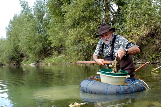 prospector panning for gold in rivers in France in the Gard region