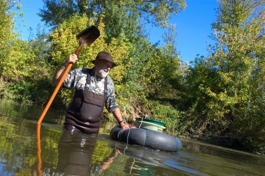 prospector panning for gold in rivers in France in the Gard region