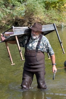 prospector panning for gold in rivers in France in the Gard region