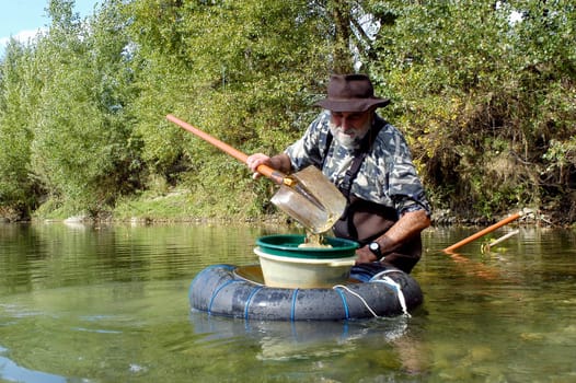 prospector panning for gold in rivers in France in the Gard region