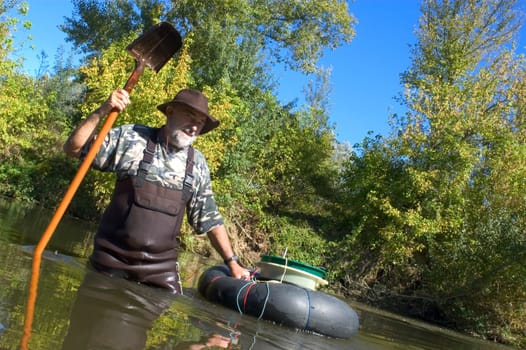 prospector panning for gold in rivers in France in the Gard region