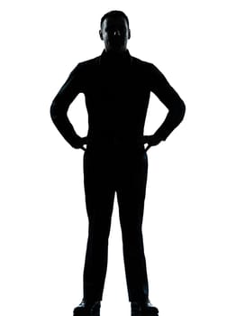 one caucasian business man silhouette standing hands on hips Full length in studio isolated on white background