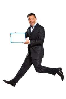 one caucasian business man running jumping double thumbs up holding whiteboard in studio isolated on white background