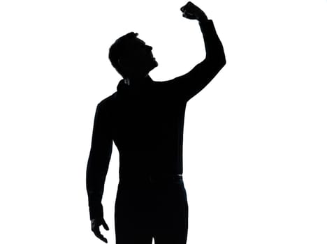 one caucasian business man angry fisting up  silhouette standing Full length in studio isolated on white background