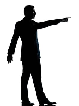 one caucasian business man silhouette standing poiting  Full length in studio isolated on white background