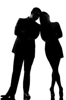 one caucasian couple man and woman standing face to face full length in studio silhouette isolated on white background